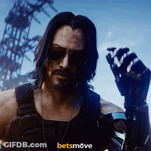 A Man Wearing Sunglasses Stands In Front Of A Sign That Says ' Betsmove ' GIF