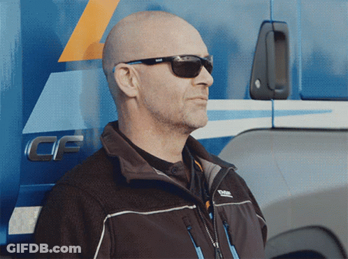 A Man Wearing Sunglasses Stands In Front Of A Truck That Says Cf On The Side GIF