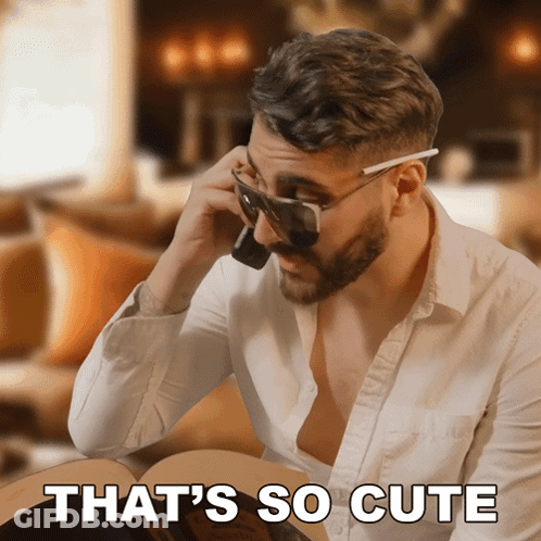 A Man Wearing Sunglasses Talking On A Cell Phone With The Words That 'S So Cute Written Below Him GIF