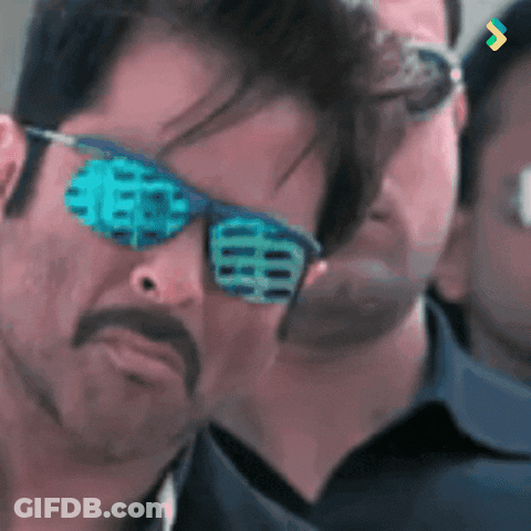 A Man Wearing Sunglasses With A Chinese Symbol On The Lens GIF