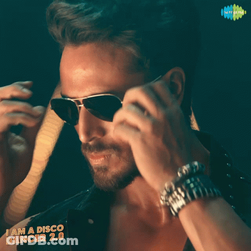A Man Wearing Sunglasses With The Words I Am A Disco Dancer 2.0 GIF