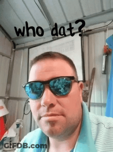 A Man Wearing Sunglasses With The Words Who Dat Written Above Him GIF