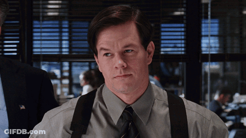 A Man Wearing Suspenders And A Tie Looks To His Left GIF