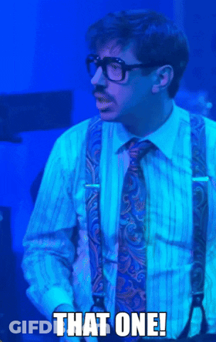 A Man Wearing Suspenders And A Tie Says " That One " GIF