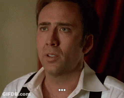 A Man Wearing Suspenders And A White Shirt Is Making A Funny Face . GIF