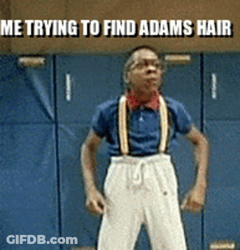 A Man Wearing Suspenders Is Standing In Front Of A Blue Wall With The Words Me Trying To Find Adams Hair Above Him GIF
