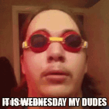 A Man Wearing Swimming Goggles With The Words It Is Wednesday My Dudes Below Him GIF