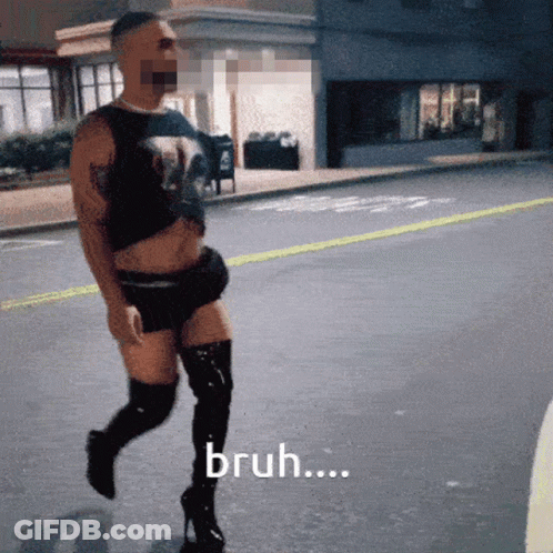 A Man Wearing Thigh High Boots And A Tank Top Is Walking Down A Street And Says Bruh ... GIF