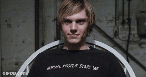 A Man Wears A Black Shirt That Says Normal People Scare Me GIF