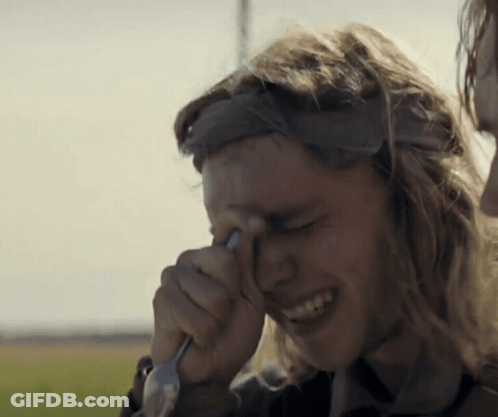 A Man Wipes His Eyes With A Fork GIF