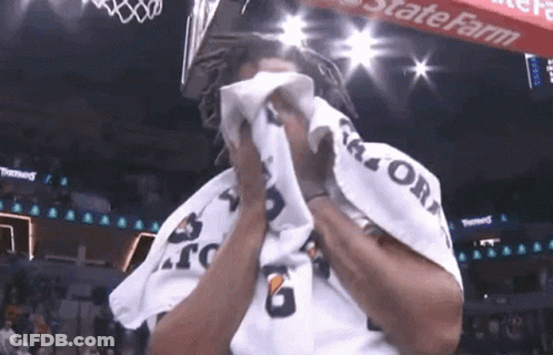 A Man Wipes His Face With A Gatorade Towel GIF