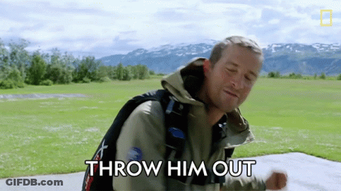 A Man With A Backpack Is Standing In A Field With The Words Throw Him Out Above Him GIF