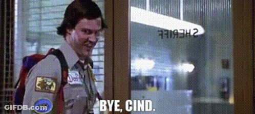 A Man With A Backpack Is Standing In Front Of A Glass Door And Saying `` Bye , Cind . '' GIF