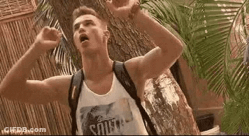 A Man With A Backpack Is Standing In Front Of A Tree . GIF