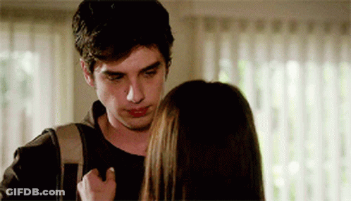 A Man With A Backpack Looks At A Woman GIF