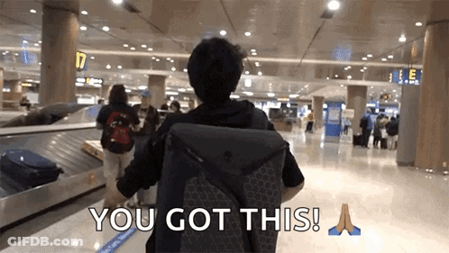 A Man With A Backpack Walking Through An Airport With The Words " You Got This " On The Bottom GIF