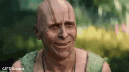 A Man With A Bald Head Is Making A Funny Face . GIF