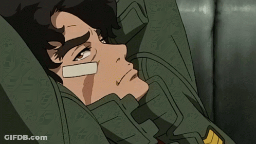 A Man With A Bandage On His Face Laying Down GIF