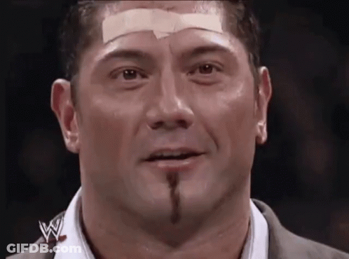 A Man With A Bandage On His Forehead And A W Logo On His Shirt GIF