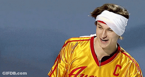 A Man With A Bandage On His Head Wears A Yellow Jersey With The Letter C On The Front GIF