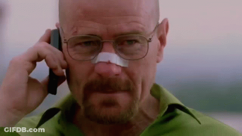 A Man With A Bandage On His Nose Is Talking On A Cell Phone GIF