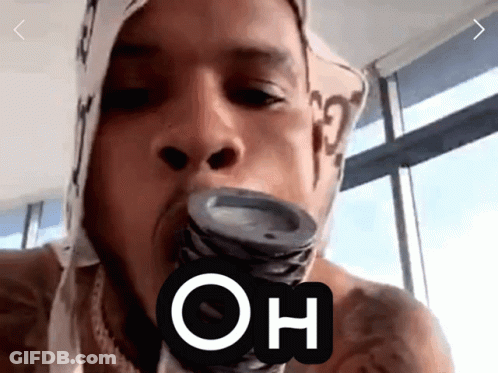 A Man With A Bandana On His Head Is Holding A Can In His Mouth With The Word Oh Above It GIF