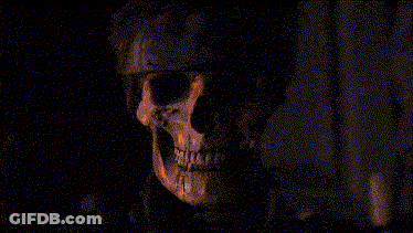 A Man With A Bandana On His Head Is Looking At The Camera In A Pixelated Image . GIF