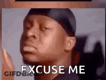 A Man With A Bandana On His Head Is Making A Funny Face And Says `` Excuse Me '' . GIF