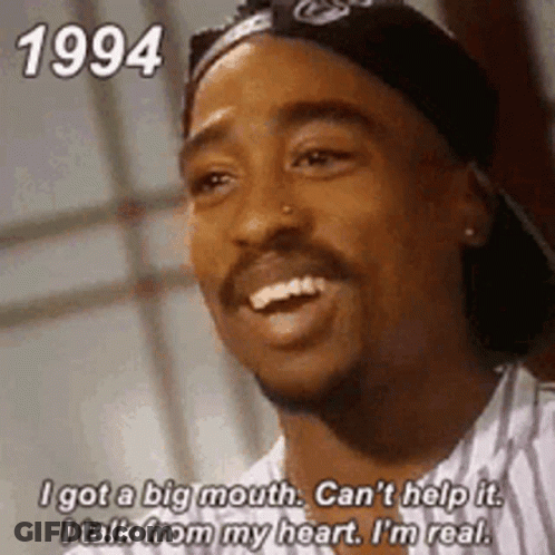 A Man With A Bandana On His Head Is Smiling And Saying `` I Got A Big Mouth . GIF