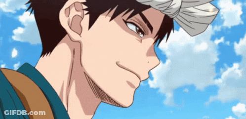 A Man With A Bandana On His Head Looks At The Camera GIF