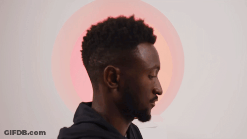 A Man With A Beard And A Black Hoodie Has A Red Circle In The Background GIF