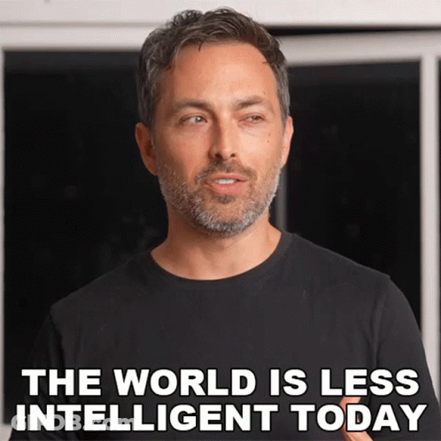 A Man With A Beard And A Black Shirt Says The World Is Less Intelligent Today GIF