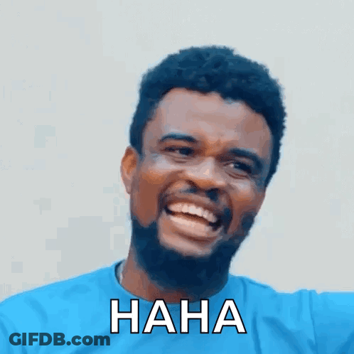A Man With A Beard And A Blue Shirt Is Laughing With The Words `` Haha '' Written On His Face . GIF