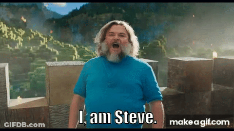 A Man With A Beard And A Blue Shirt Is Standing In Front Of A Mountain And Saying I Am Steve . GIF