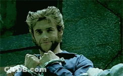 A Man With A Beard And A Blue Shirt Is Wearing Handcuffs GIF