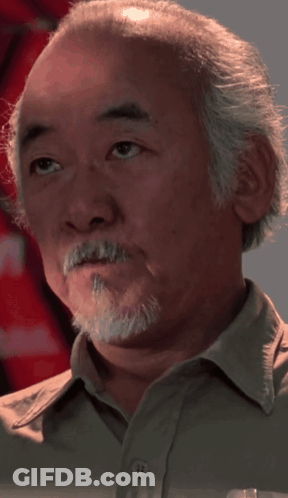 A Man With A Beard And A Button Up Shirt GIF