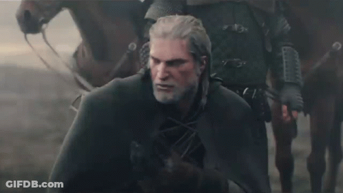 A Man With A Beard And A Cape Is Standing Next To A Horse GIF