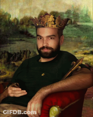 A Man With A Beard And A Crown On His Head GIF