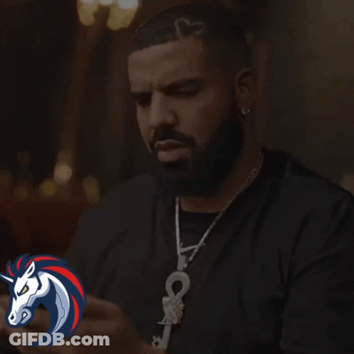 A Man With A Beard And A Heart In His Hair Is Saying Wow GIF
