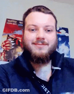 A Man With A Beard And A Lanyard That Says District GIF