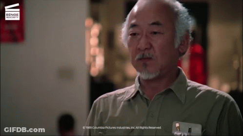 A Man With A Beard And A Name Tag That Says Columbia Pictures Industries Inc. All Rights Reserved GIF