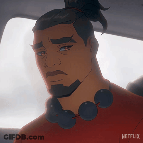 A Man With A Beard And A Red Shirt Is Sitting In A Car With A Netflix Logo Behind Him GIF