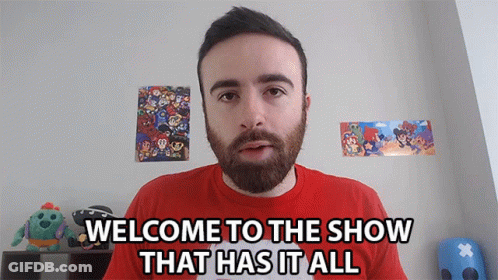 A Man With A Beard And A Red Shirt Says " Welcome To The Show That Has It All " GIF