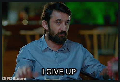 A Man With A Beard And A Ring On His Finger Says I Give Up GIF
