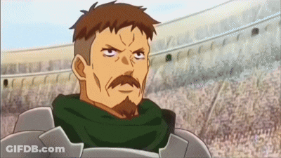 A Man With A Beard And A Scarf Around His Neck Is Looking At The Camera GIF