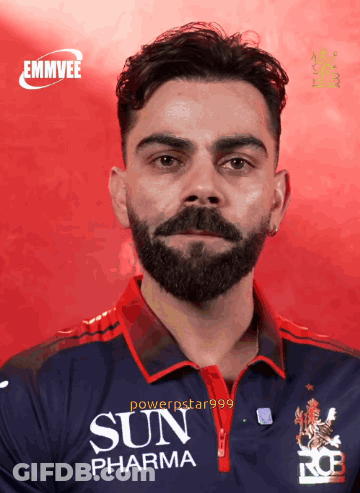 A Man With A Beard And A Sun Pharma Shirt GIF