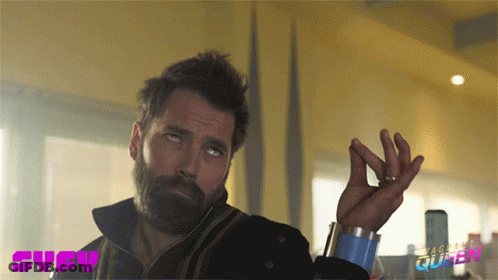 A Man With A Beard And A Syfy Logo On The Bottom Right GIF