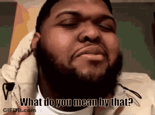 A Man With A Beard And A White Jacket Says What Do You Mean By That GIF