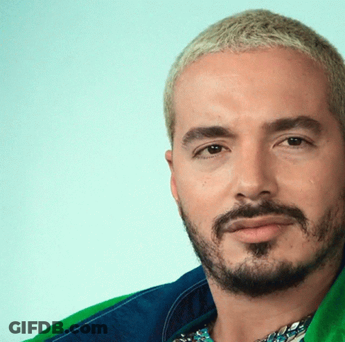 A Man With A Beard And Blonde Hair Is Wearing A Blue And Green Jacket GIF