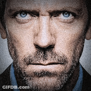 A Man With A Beard And Blue Eyes Looks At The Camera GIF